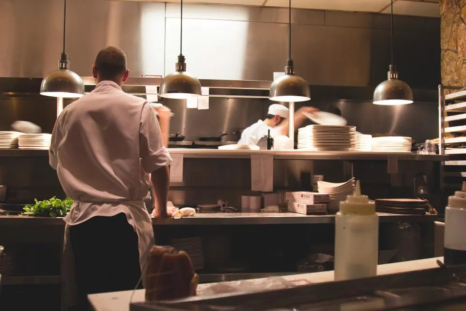 A chef working in a restaurant kitchen
